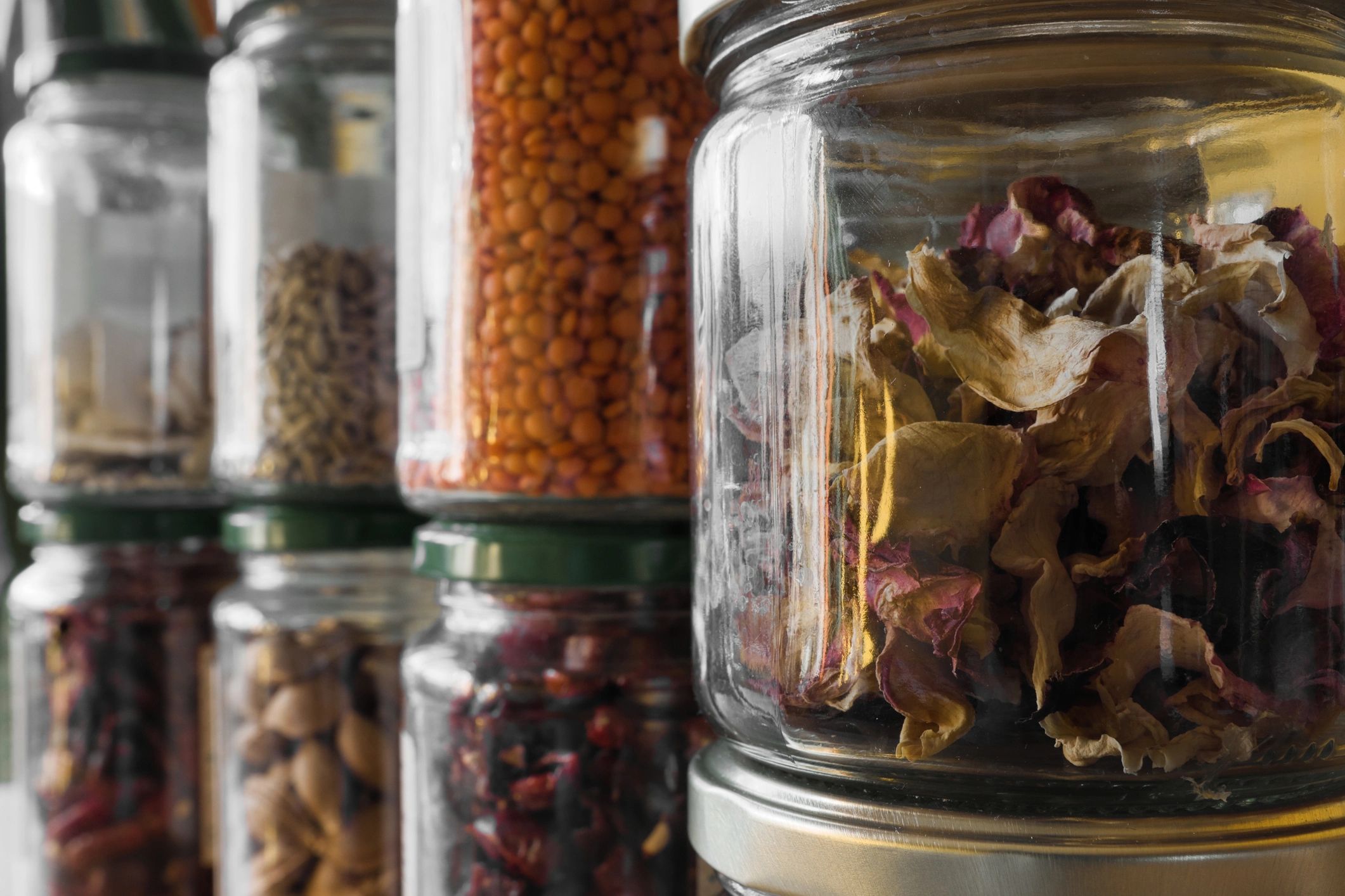 Wellness ingredients arranged in glass vessels
