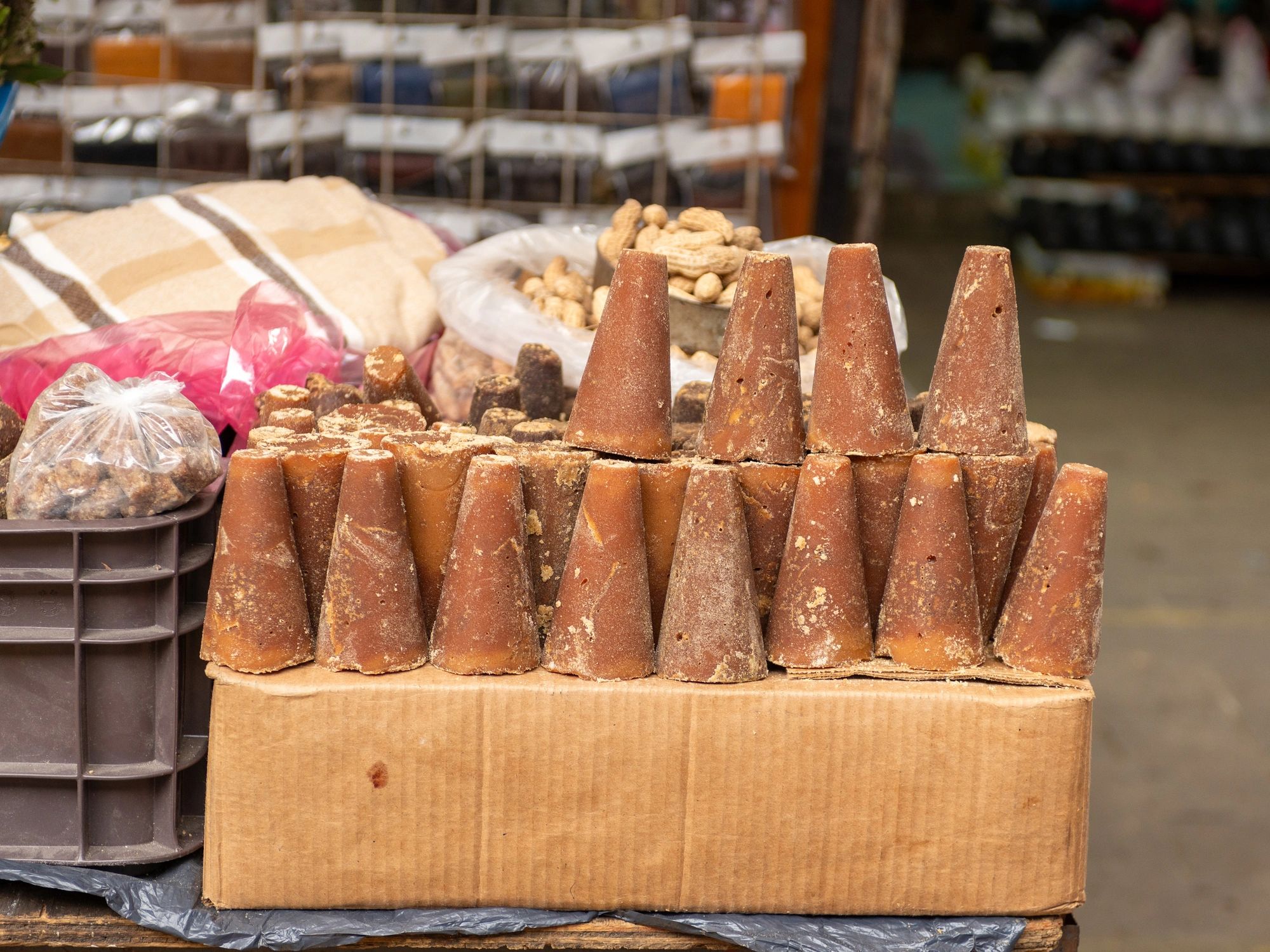 Traditional unrefined cane sugar cones at a market