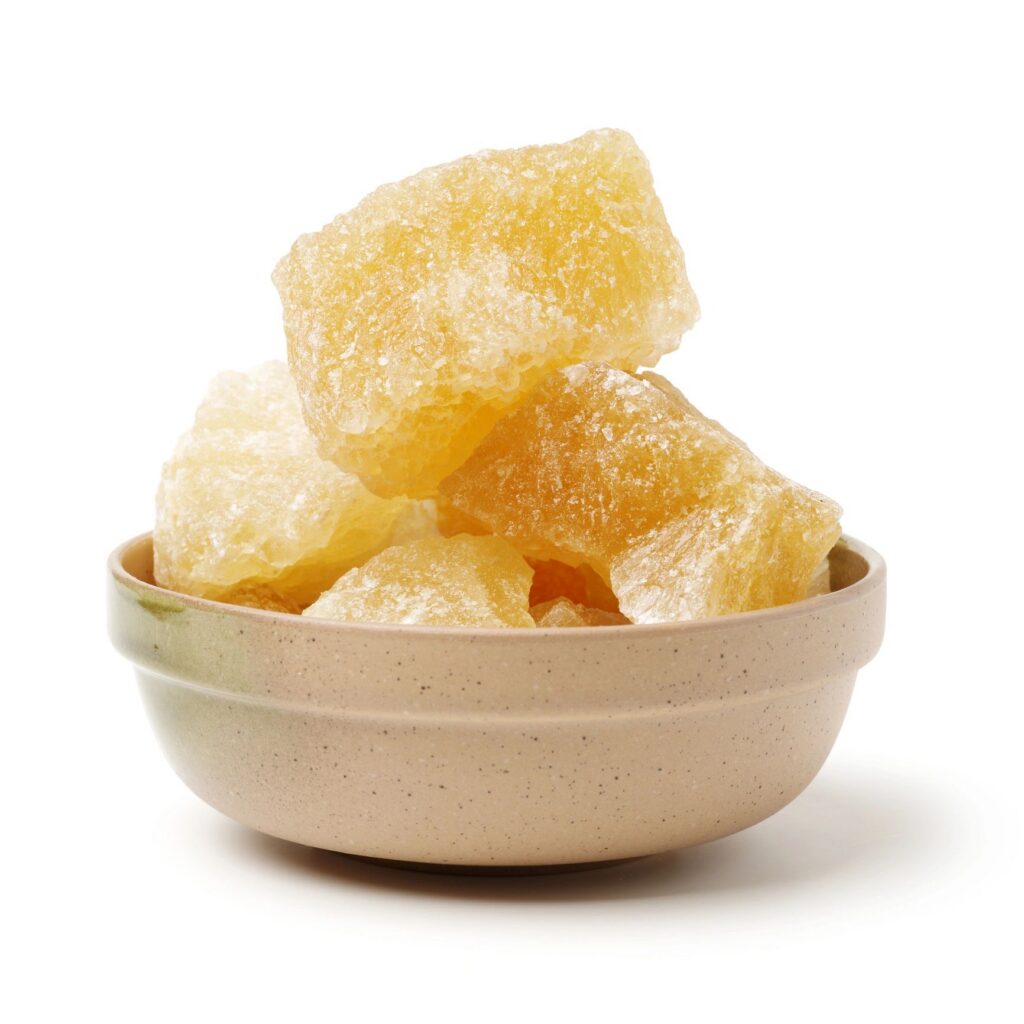 brown crystal sugar on white background
